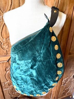 MAXX New York green velvet handbag with gold Medallion trim.